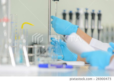 scientist is demonstrate the titration technique 26900473