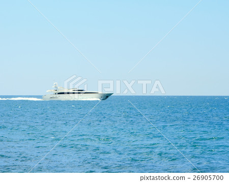 Luxury white speed yatch in open waters full ahead Luxury white speed yatch in open waters full ahead 26905700