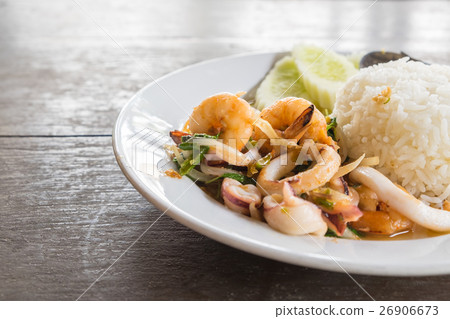 RIce topped with spicy stir fried seafood basil RIce topped with spicy stir fried seafood basil 26906673