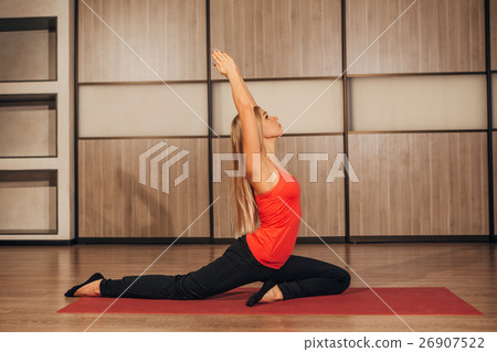 woman in a traditional yoga pose 26907522