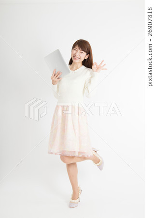 A woman with a tablet A woman with a tablet 26907818