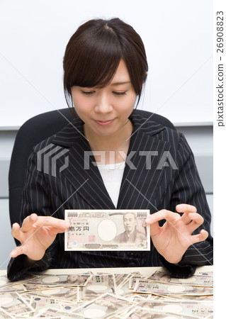 A woman rejoicing money A woman rejoicing money 26908823