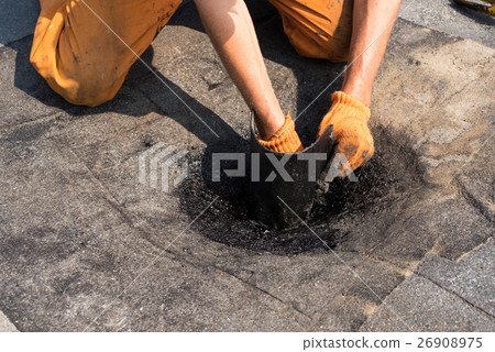 Roofer doing repair roof drain. Roofer doing repair roof drain. 26908975