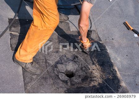Roofer doing repair roof drain. 26908979