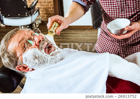 The senior man visiting hairstylist in barber shop 26913752