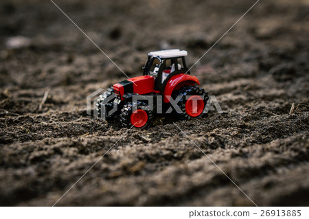 toy tractor on the field 26913885