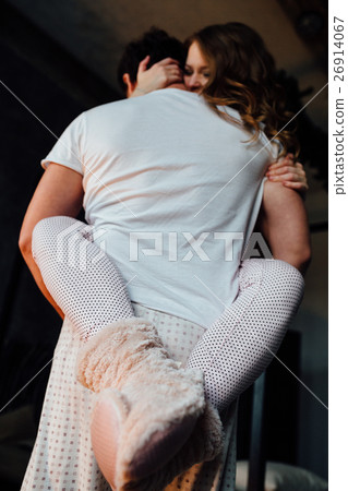 Loving Couple hold and lift girl on hands. 26914067