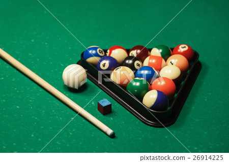 Billiard balls near by cue and chalk. 26914225