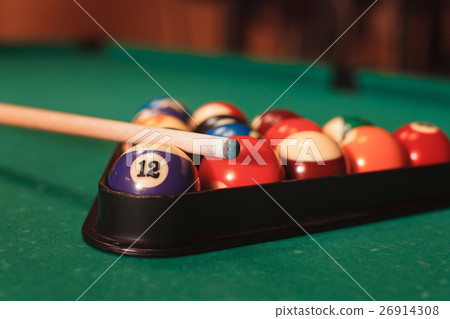 Billiard balls near by cue and chalk. 26914308