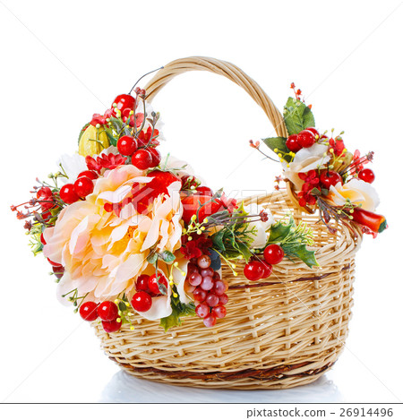 Basket decorated with flowers on white background Basket decorated with flowers on white background 26914496