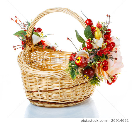 Basket decorated with flowers on white background 26914631