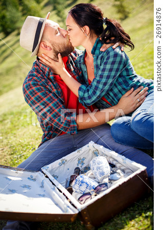 loving couple in field on picnic. loving couple in field on picnic. 26914876