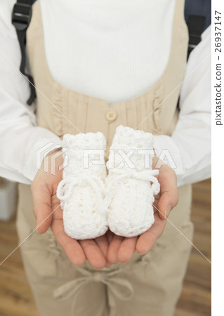 Pregnant women with first shoes 26937147