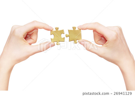 puzzle in hand isolated on white background 26941129