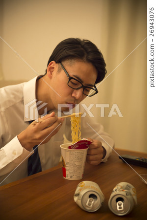 Men lonely eat cup ramen 26943076