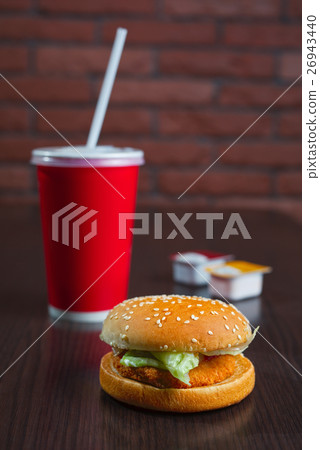 burger and paper cup coke or juice 26943440