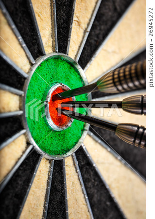 three darts in bull's eye, close up three darts in bull's eye, close up 26945272