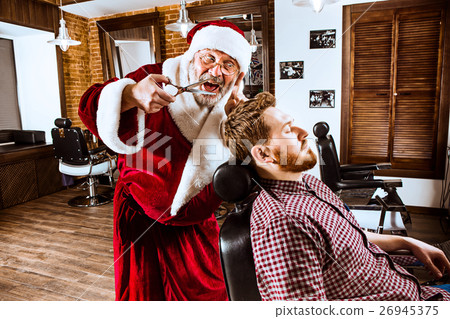Santa claus as master at barber shop 26945375