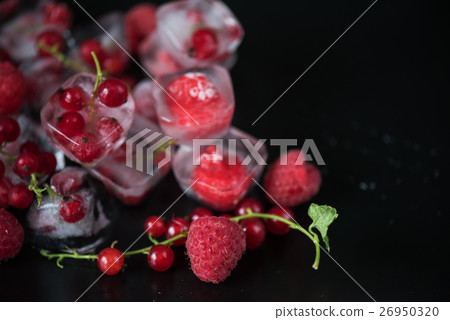 Frozen berries on wooden table 26950320