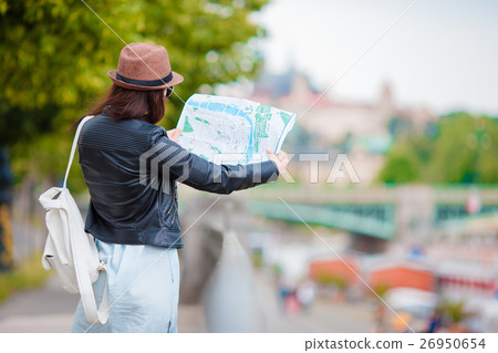 Beautiful woman with touristic citymap in the city Beautiful woman with touristic citymap in the city 26950654