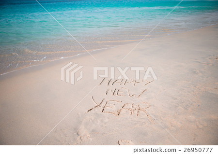 Happy New Year written in the white sand Happy New Year written in the white sand 26950777