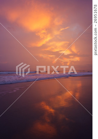 Sunset clouds and waves on empty beach Sunset clouds and waves on empty beach 26951678