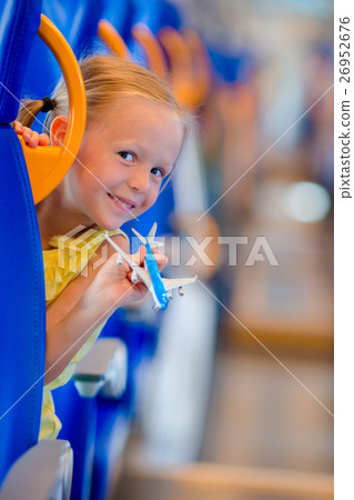 Adorable little girl traveling on train and having Adorable little girl traveling on train and having 26952676
