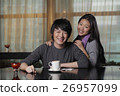 Young couple at cafe smiling 26957099