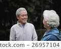 A senior man talking to a senior woman 26957104