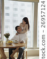 Young couple smiling at each other in their condo 26957124