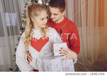 loving couple decorating Christmas tree 26961309
