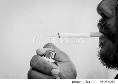 Young man smoking,black and white tone Young man smoking,black and white tone 26964068