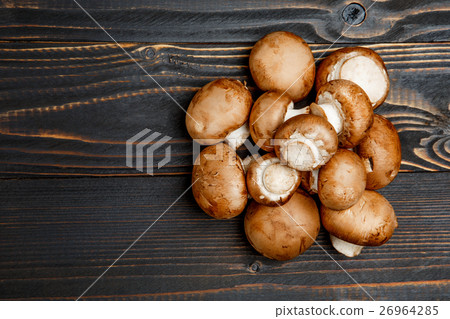 champignon mushroom on wooden background 26964285
