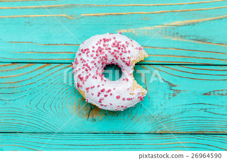 Donuts on colorful wooden background 26964590