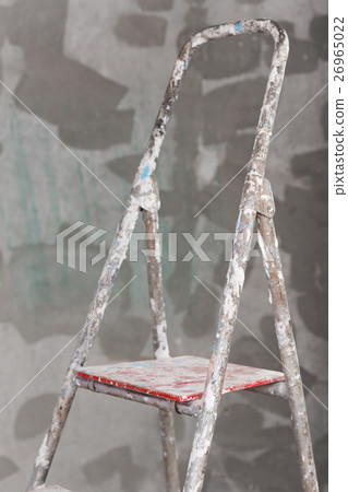 Old painted and stucco ladder on concrete wall 26965022
