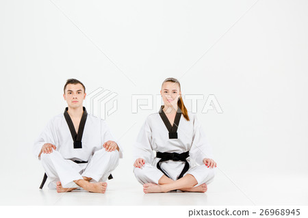 The karate girl and boy with black belts 26968945
