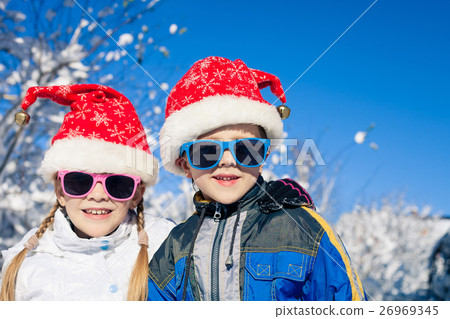 Happy little children playing in winter snow day. Happy little children playing in winter snow day. 26969345