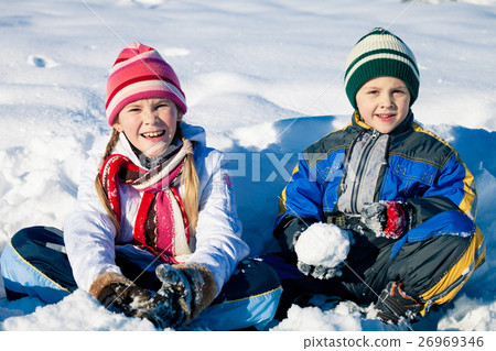 Happy little children playing in winter snow day. Happy little children playing in winter snow day. 26969346