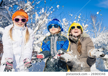 Happy little children playing in winter snow day. Happy little children playing in winter snow day. 26969348