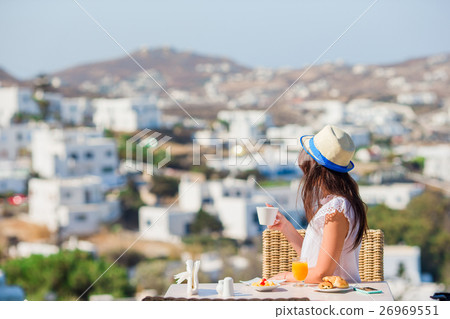 Beautiful elegant girl having breakfast at outdoor Beautiful elegant girl having breakfast at outdoor 26969551