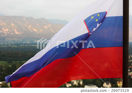 Slovenian national flag fluttering over Lake Bled Slovenian national flag fluttering over Lake Bled 26973529