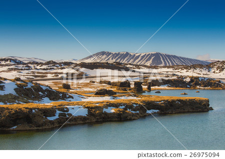 Volcano over the lake with clear blue sky 26975094