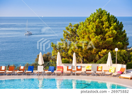 Swimming pool on a sunny day Swimming pool on a sunny day 26975882