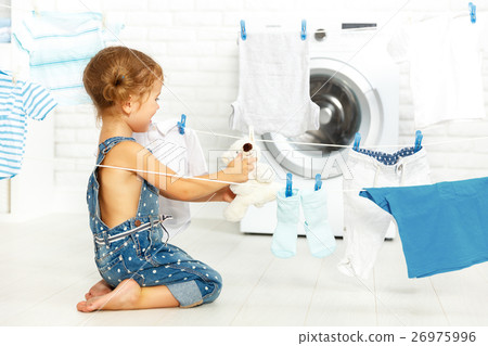 child fun happy little girl to wash clothes child fun happy little girl to wash clothes 26975996
