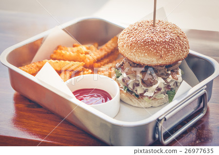 Home made hamburger with lettuce and cheese. Home made hamburger with lettuce and cheese. 26977635
