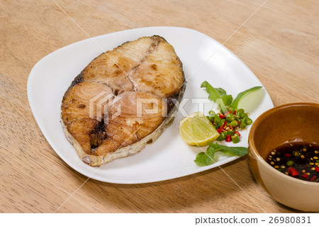 spanish mackerel steak on wood background 26980831
