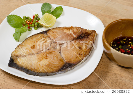 spanish mackerel steak on wood background 26980832