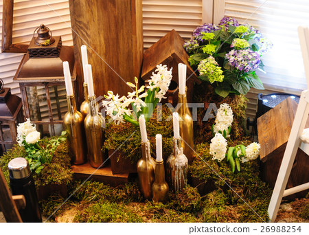 wedding decor with flowers and bottle candles 26988254