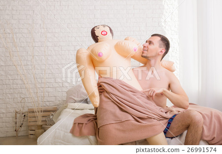 Man put sex doll on his knees. Stock Photo 26991574 PIXTA