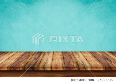 Empty top of wooden table on green background. Empty top of wooden table on green background. 26992249